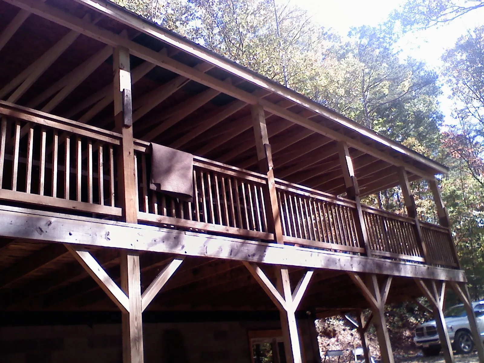 Timber framing under a new elevated porch and deck — Roof Leak Repair in Syracuse by Roofing Brothers